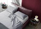Double bed in Soho burgundy leather with Yoko linen sheet - BertO